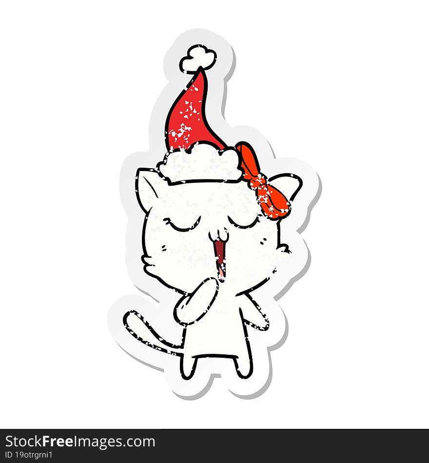 distressed sticker cartoon of a cat wearing santa hat