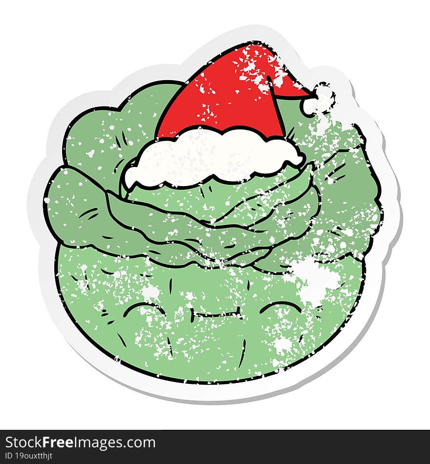 distressed sticker cartoon of a cabbage wearing santa hat