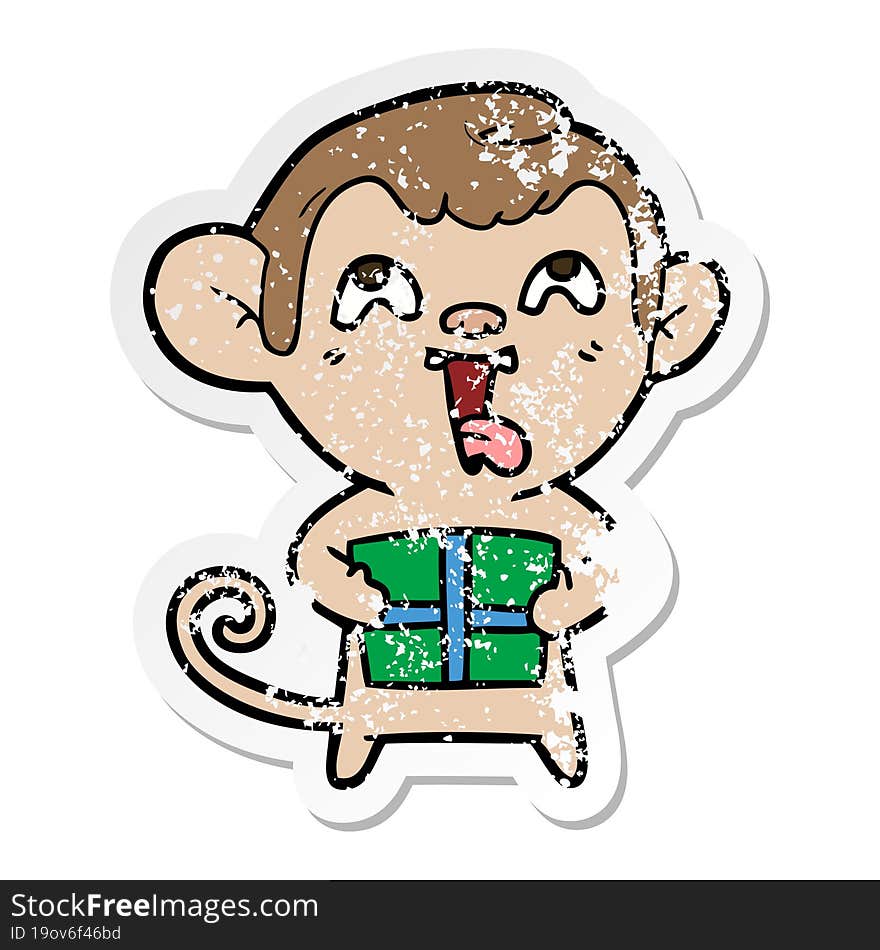 Distressed Sticker Of A Crazy Cartoon Monkey With Christmas Present