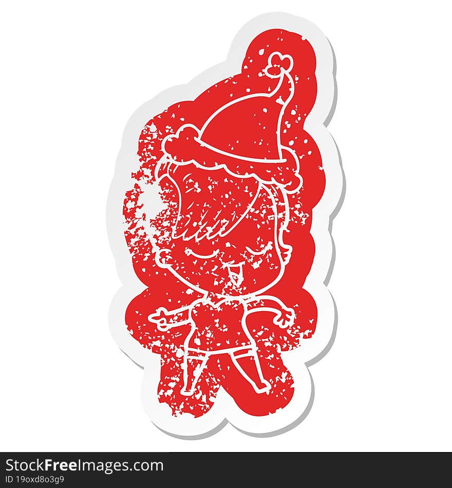 Happy Cartoon Distressed Sticker Of A Girl Wearing Santa Hat