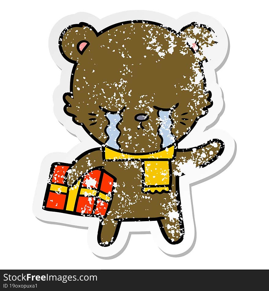 distressed sticker of a crying cartoon bear with present