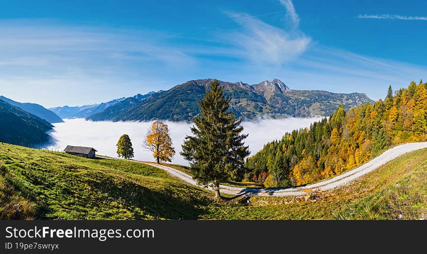 Sunny idyllic autumn alpine scene. Peaceful misty morning Alps mountain view from hiking path from Dorfgastein to Paarseen lakes, Land Salzburg, Austria. Picturesque hiking and seasonal concept scene. Sunny idyllic autumn alpine scene. Peaceful misty morning Alps mountain view from hiking path from Dorfgastein to Paarseen lakes, Land Salzburg, Austria. Picturesque hiking and seasonal concept scene