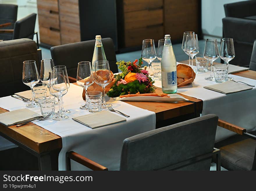 Deserted arranged table at elegant restaurant metaphoric image of business meeting concept