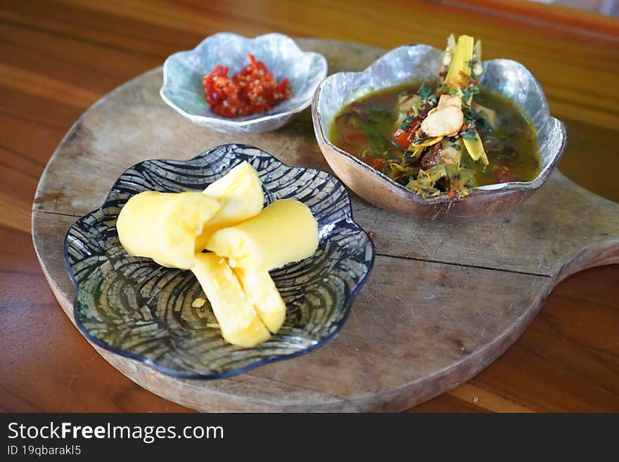 Fish Soup with casava on the wooden table