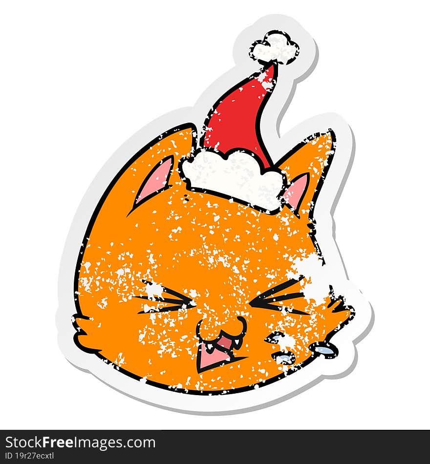 spitting hand drawn distressed sticker cartoon of a cat face wearing santa hat