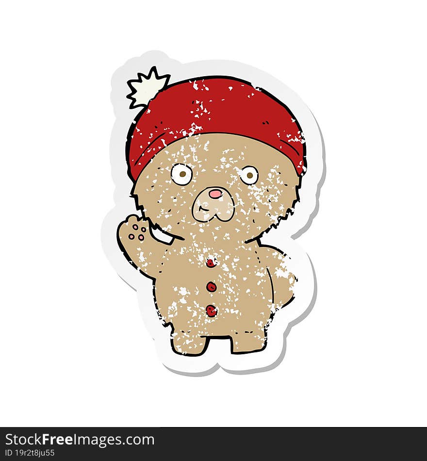 retro distressed sticker of a cartoon waving teddy bear in winter hat