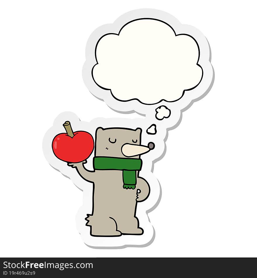 cartoon bear with apple and thought bubble as a printed sticker