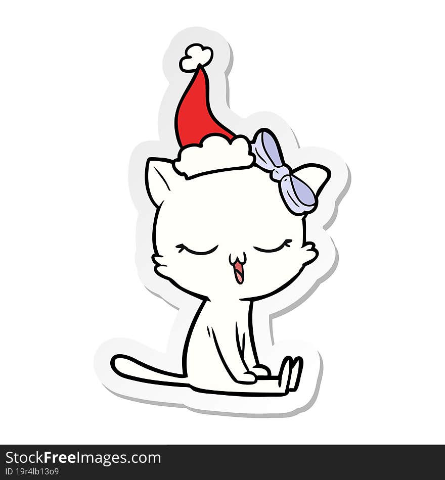 sticker cartoon of a cat with bow on head wearing santa hat