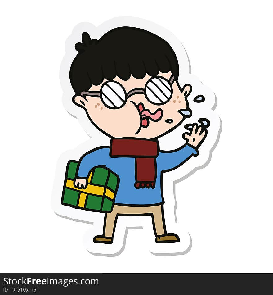 sticker of a cartoon boy wearing spectacles with christmas gift