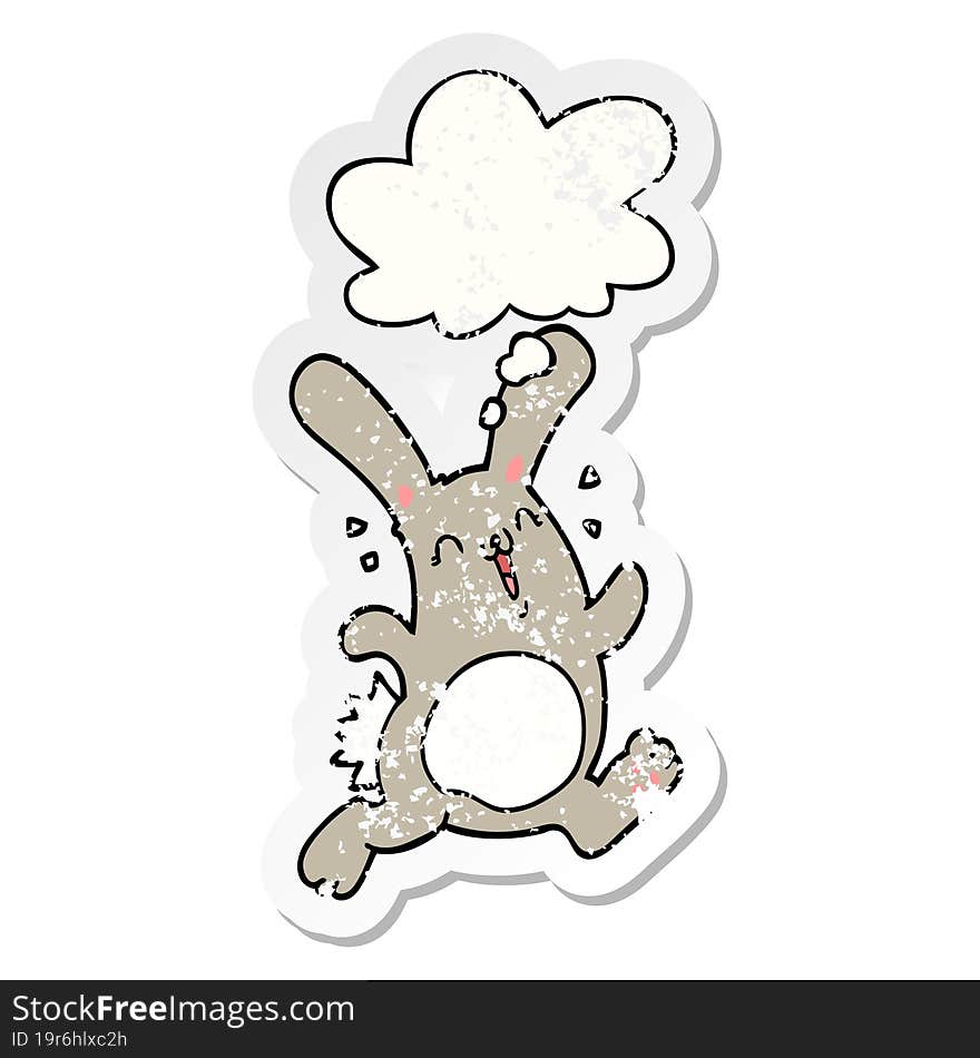 cartoon rabbit and thought bubble as a distressed worn sticker