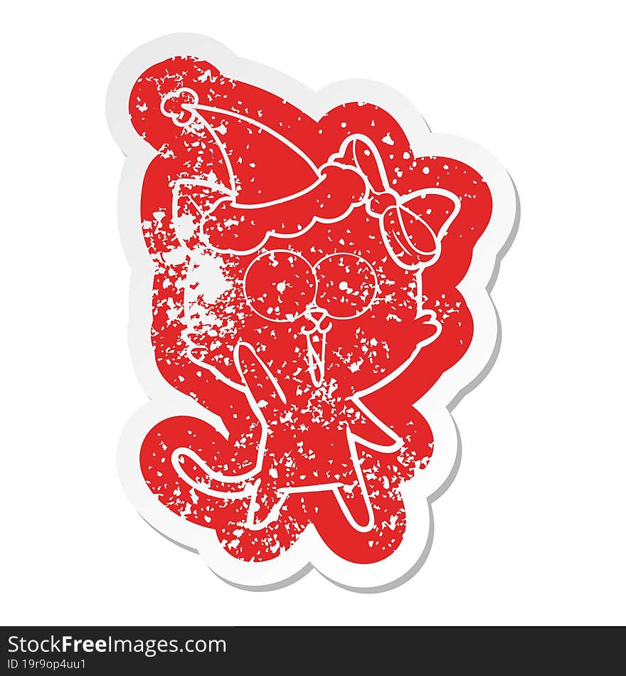 cartoon distressed sticker of a cat wearing santa hat