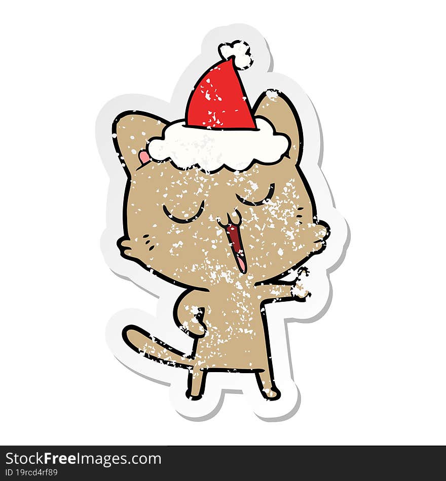 distressed sticker cartoon of a cat singing wearing santa hat