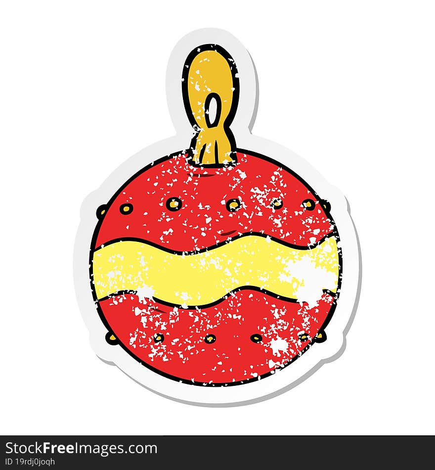 distressed sticker of a cartoon christmas bauble