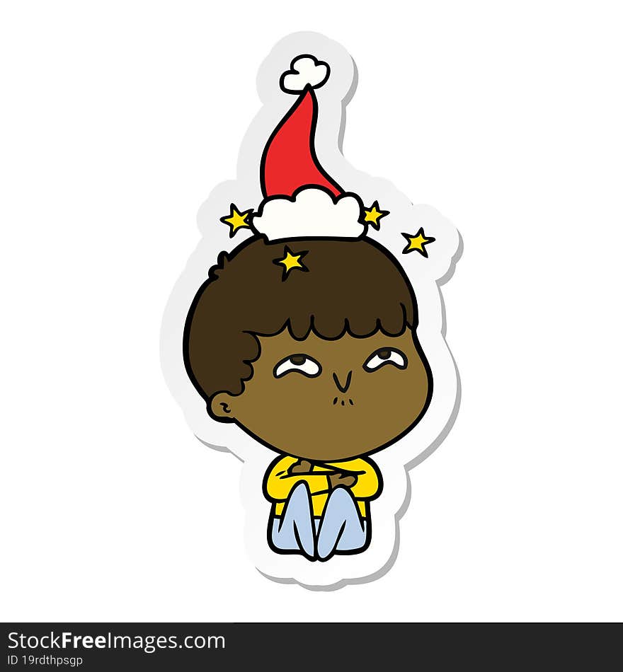 sticker cartoon of a amazed boy wearing santa hat