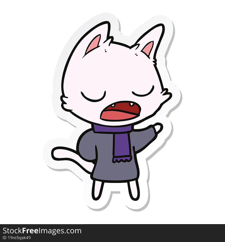 sticker of a talking cat wearing winter clothes