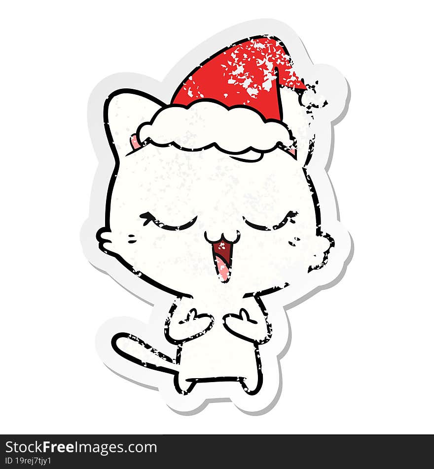 happy distressed sticker cartoon of a cat wearing santa hat