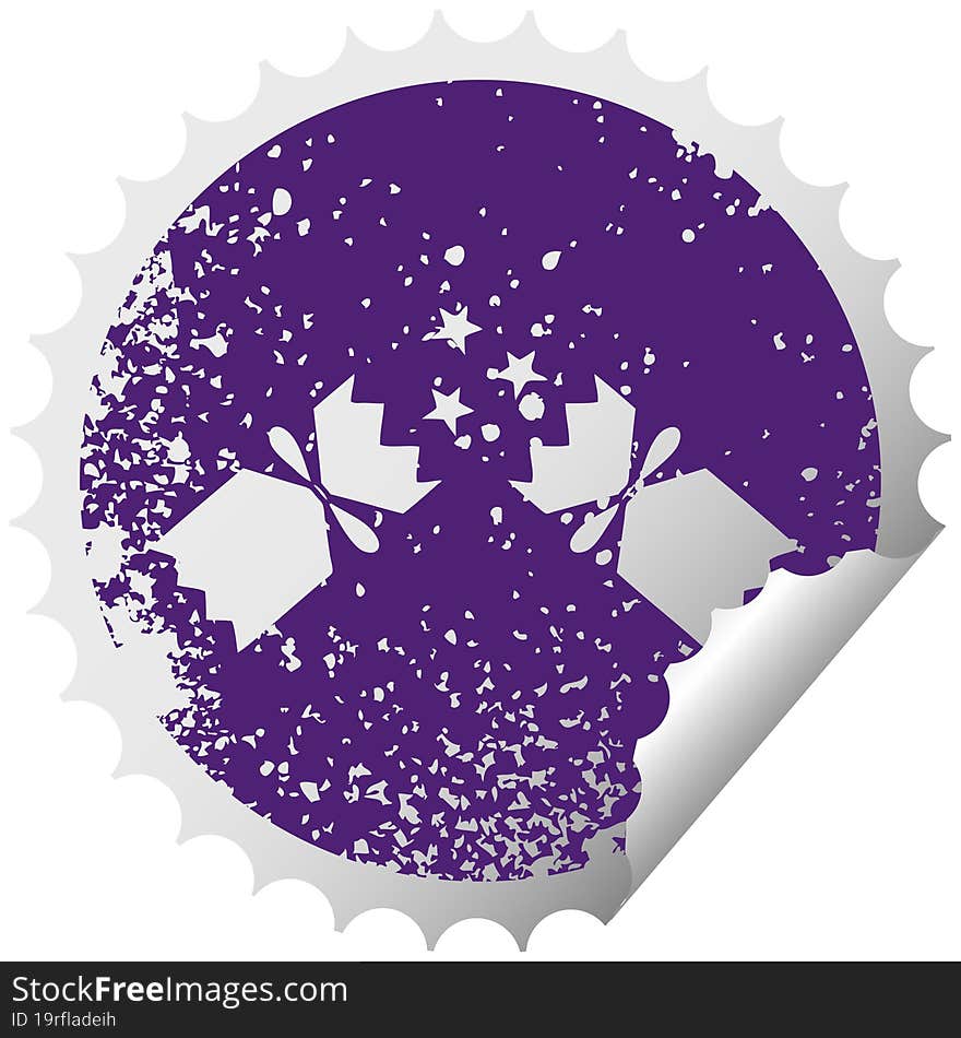 distressed circular peeling sticker symbol of a christmas cracker