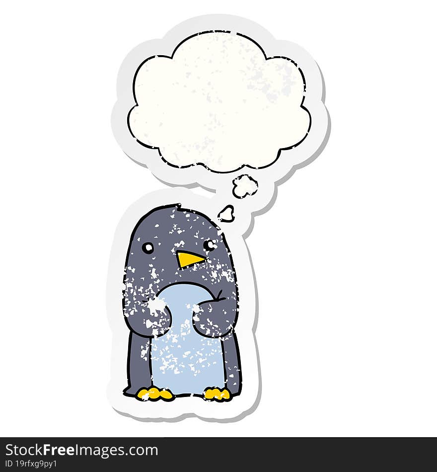 cartoon penguin and thought bubble as a distressed worn sticker