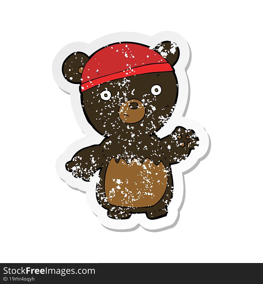 retro distressed sticker of a cartoon black bear wearing hat