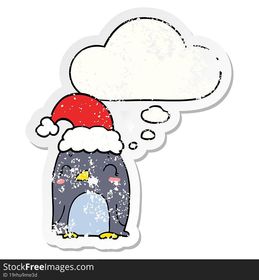 cute christmas penguin and thought bubble as a distressed worn sticker