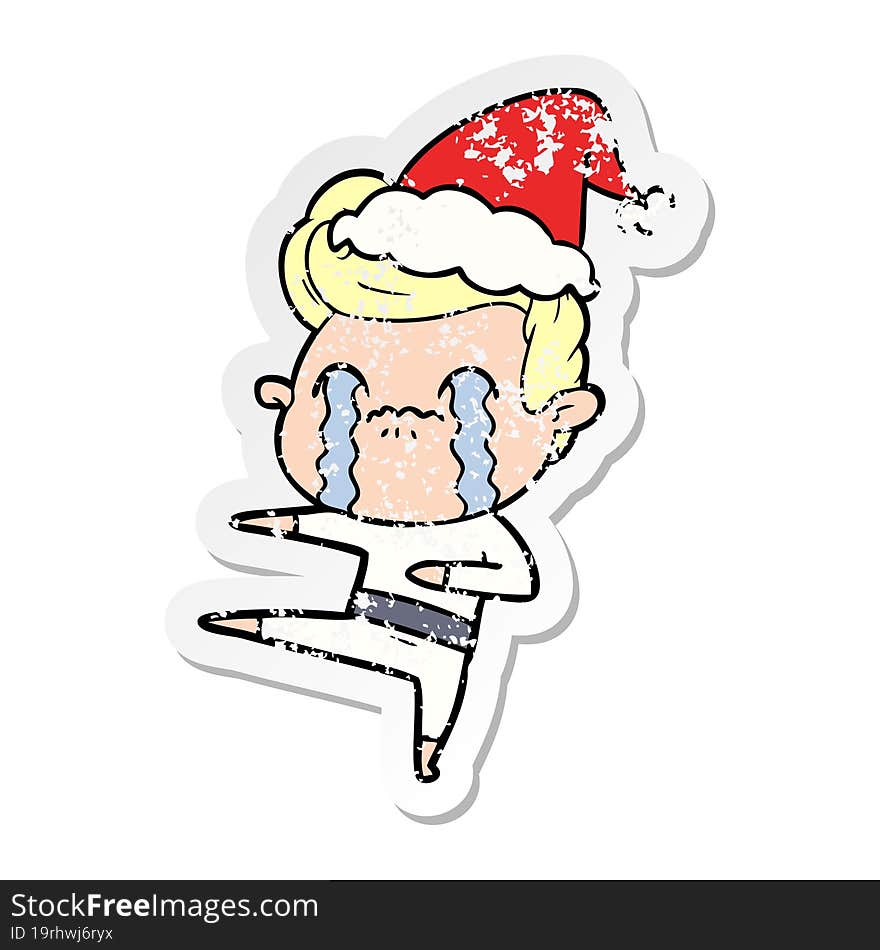 Distressed Sticker Cartoon Of A Man Crying Wearing Santa Hat