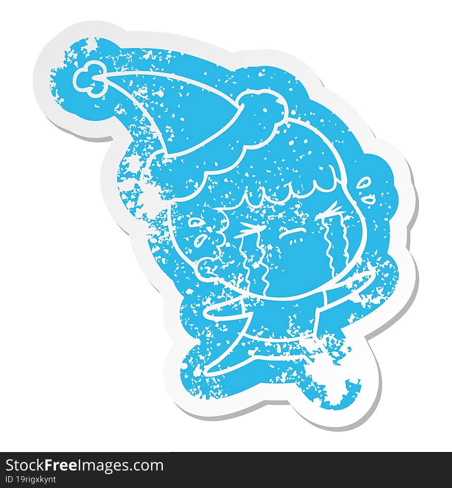 cartoon distressed sticker of a man crying wearing santa hat