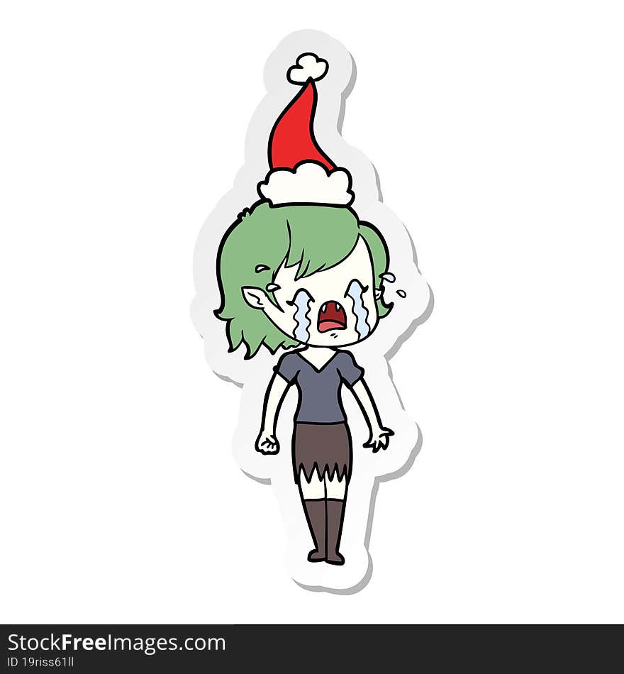 sticker cartoon of a crying vampire girl wearing santa hat