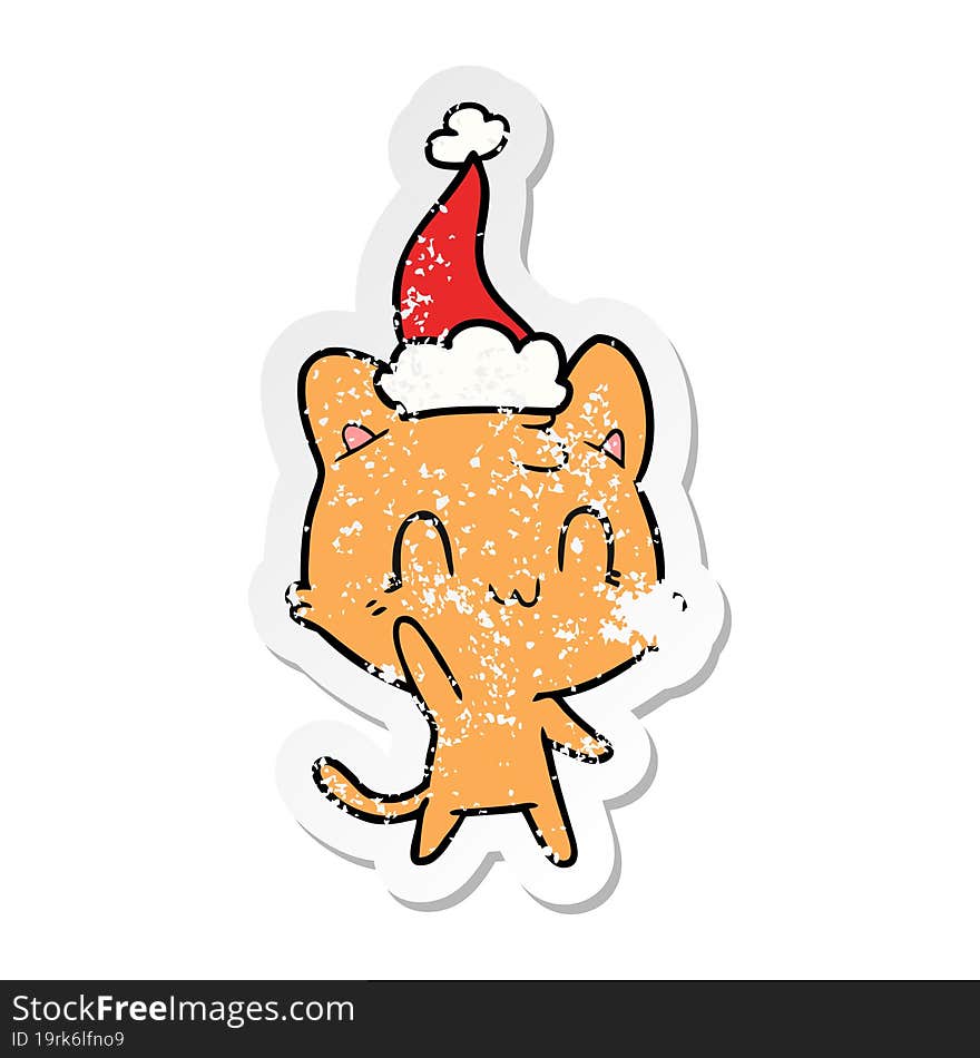 hand drawn distressed sticker cartoon of a happy cat wearing santa hat