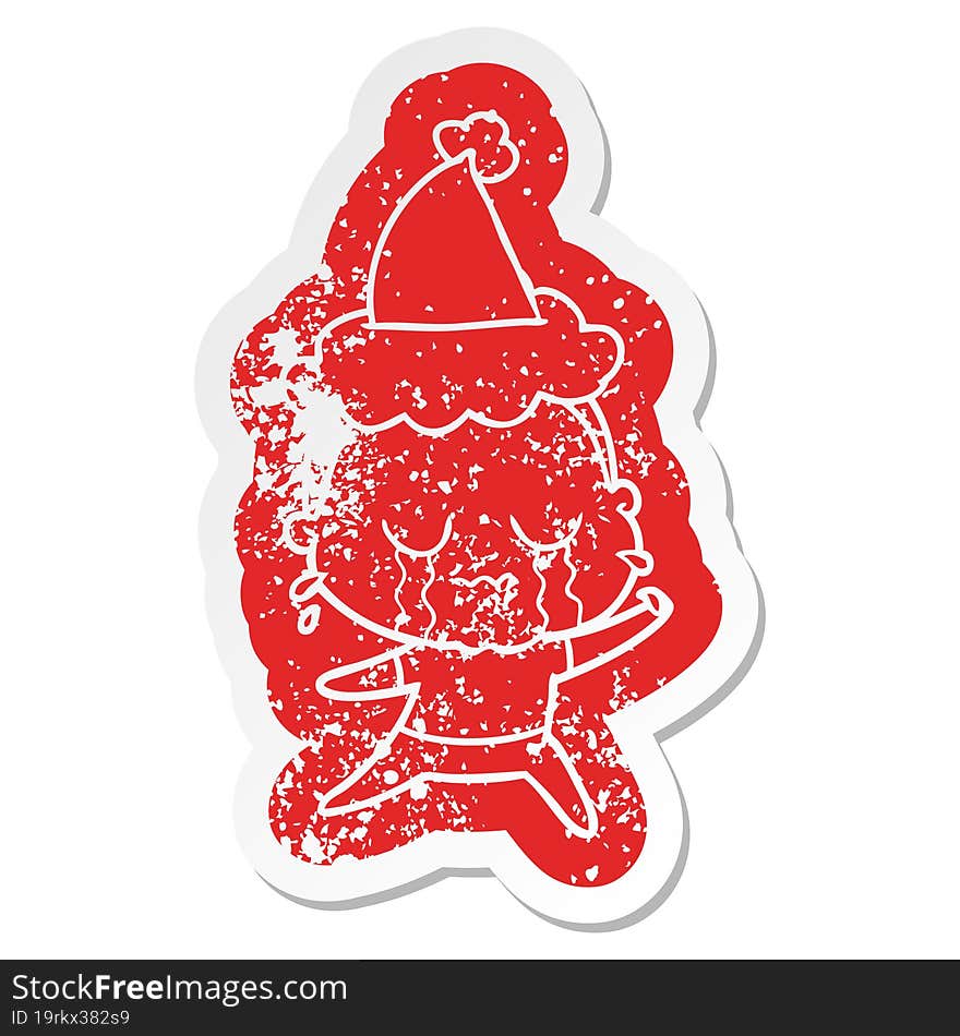 cartoon distressed sticker of a crying old lady wearing santa hat