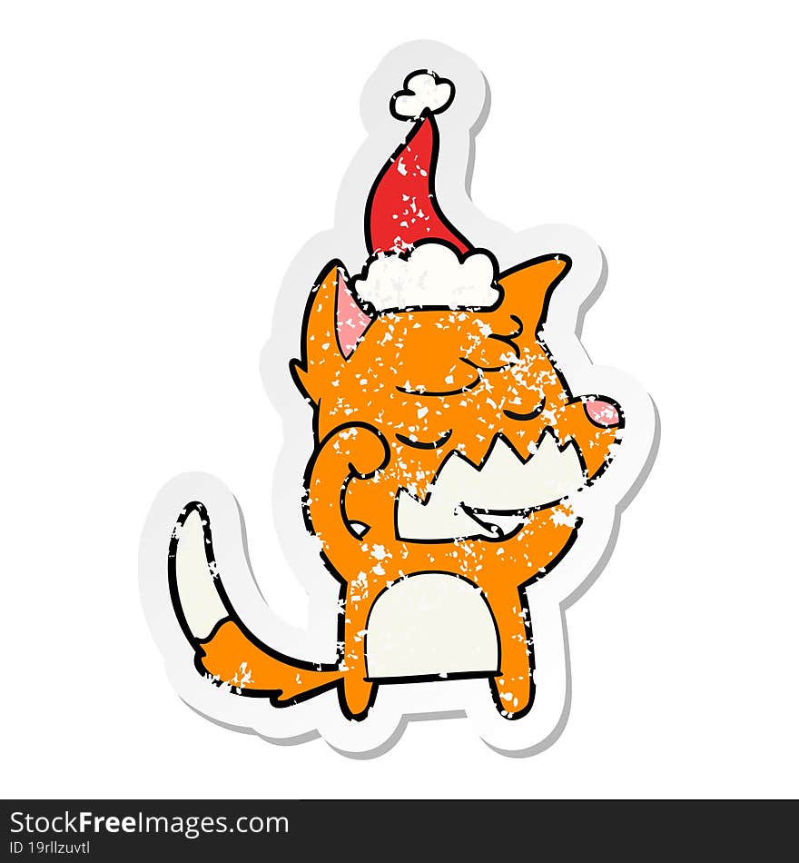 friendly distressed sticker cartoon of a fox waking up wearing santa hat