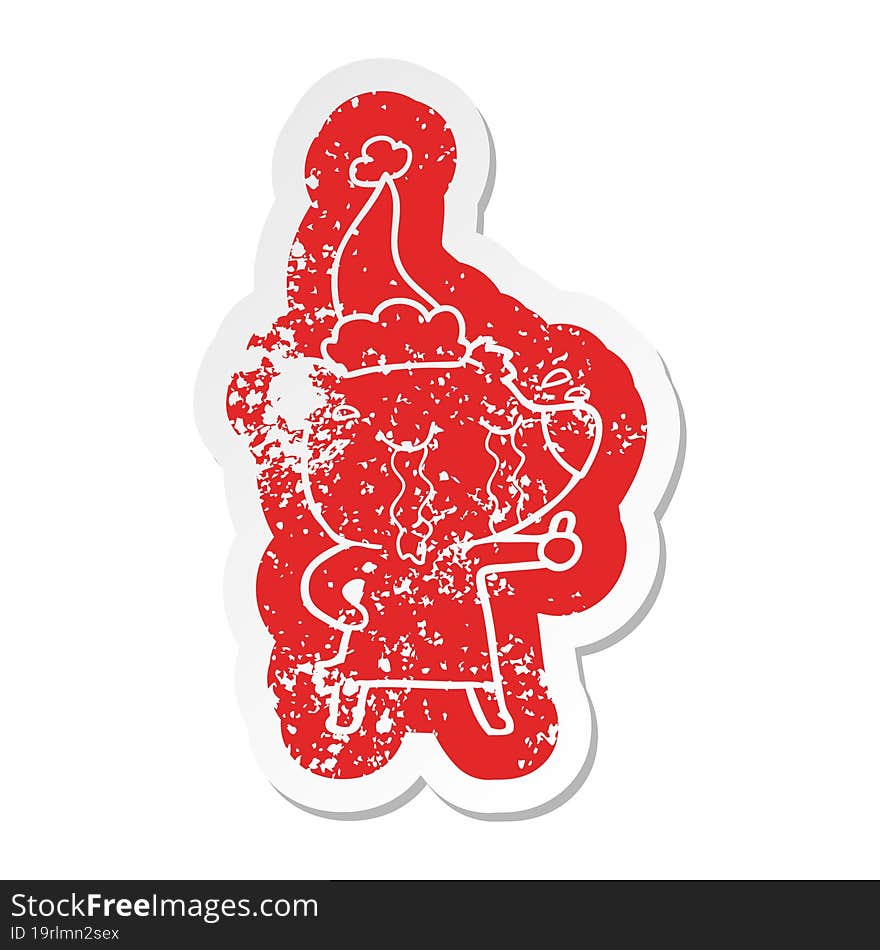 Cartoon Distressed Sticker Of A Crying Bear Wearing Santa Hat