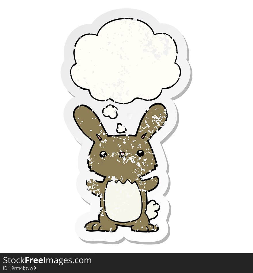 cute cartoon rabbit and thought bubble as a distressed worn sticker