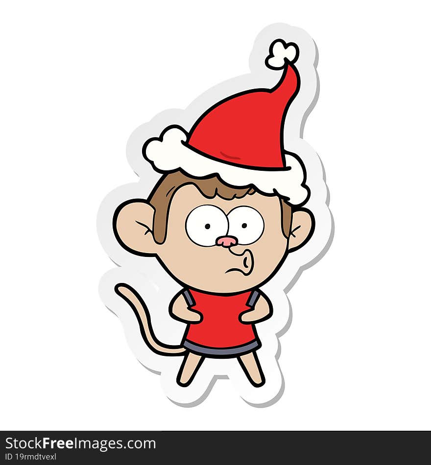 hand drawn sticker cartoon of a surprised monkey wearing santa hat