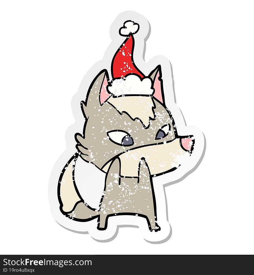 shy distressed sticker cartoon of a wolf wearing santa hat