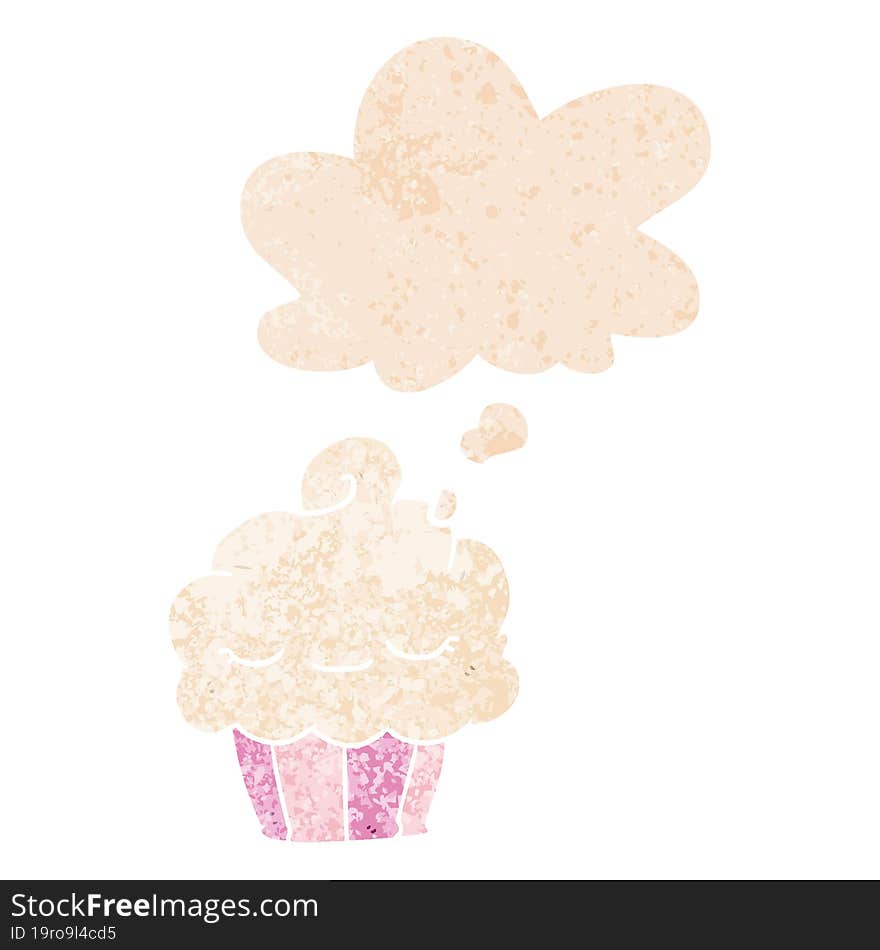 cartoon cupcake with thought bubble in grunge distressed retro textured style. cartoon cupcake with thought bubble in grunge distressed retro textured style