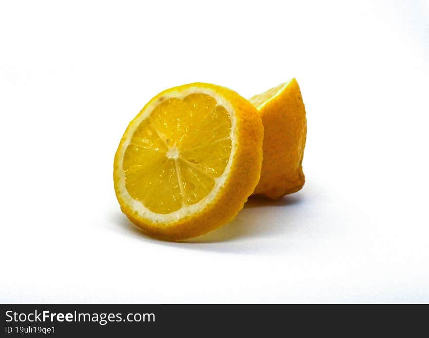 Close-up photo of a lemon and lemon slices.