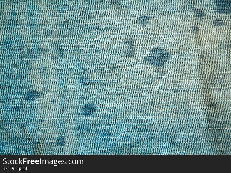 Background, texture, light blue denim and water drops.