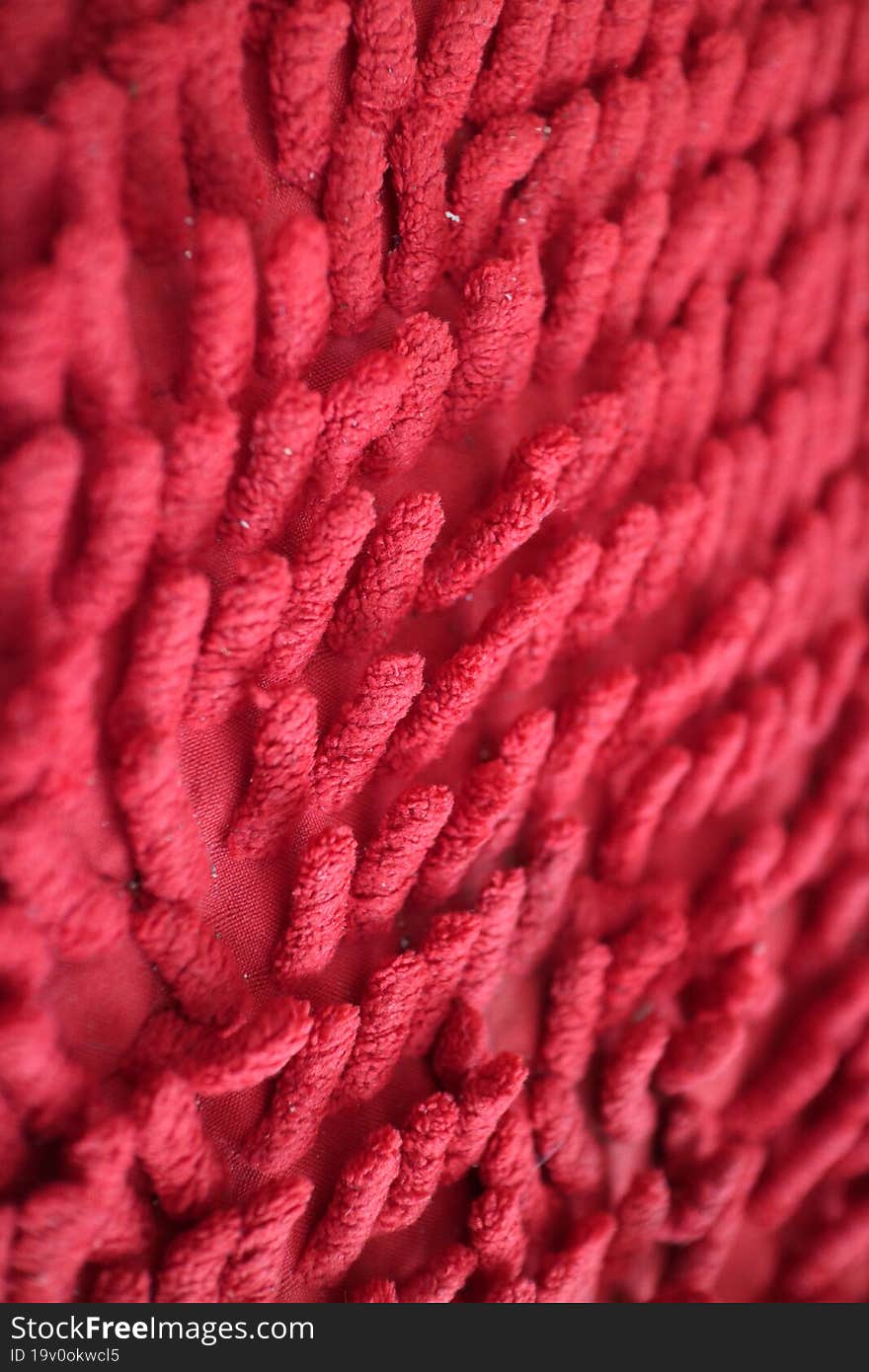 A Photo Of A The Unique Texture Of The Red Mat