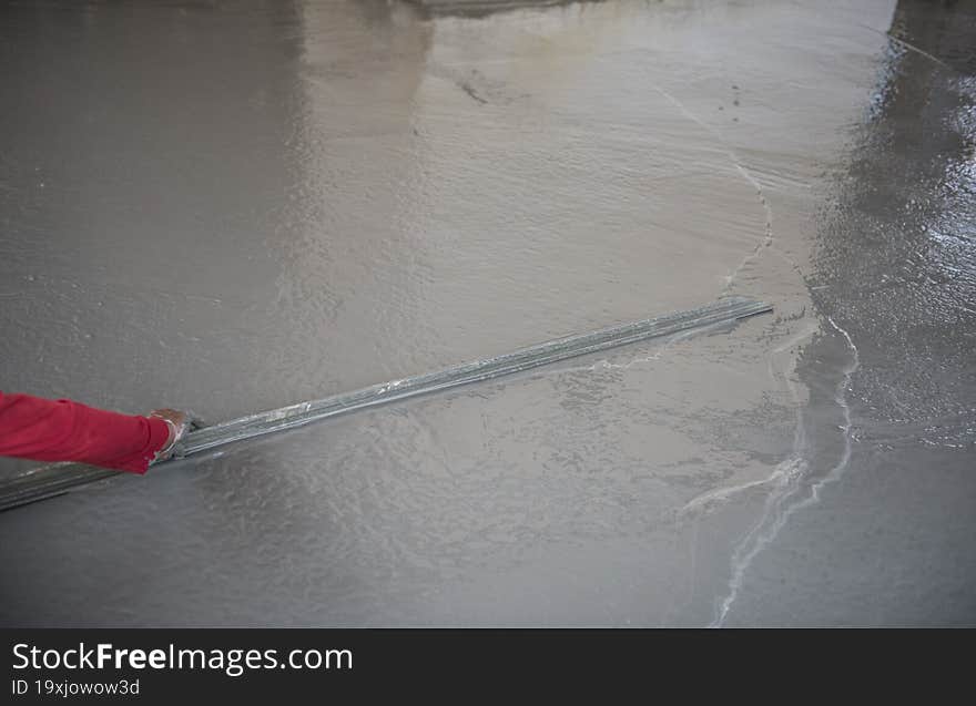 industrial worker with plastering tools renovating a house. builder worker plastering facade industrial building with