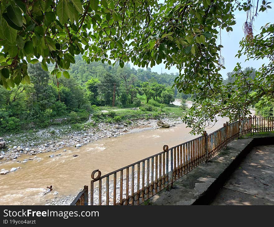 view of a muddy stream in rural landscape