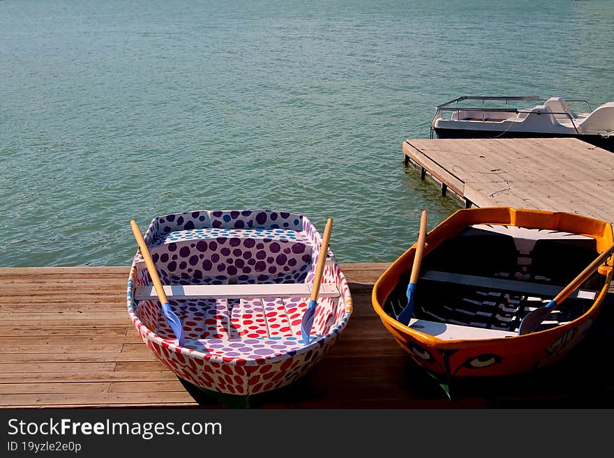 Wooden boats at the pier. river bank in summer