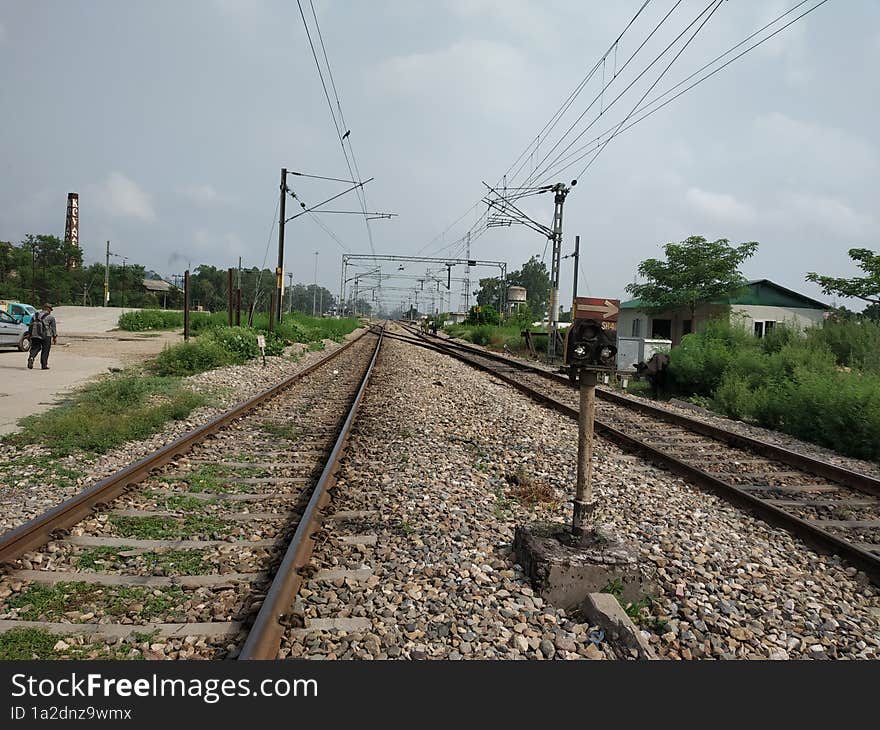 view of a railway track in rural landscape