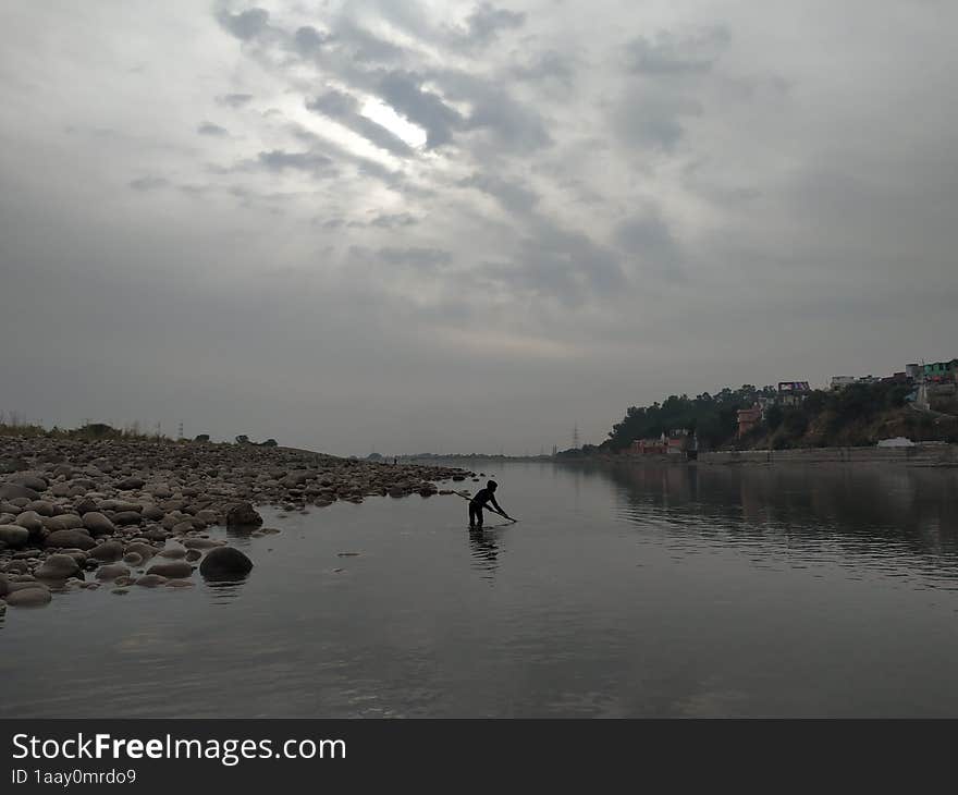 fishing in shallow water in Akhnoor, Jammu