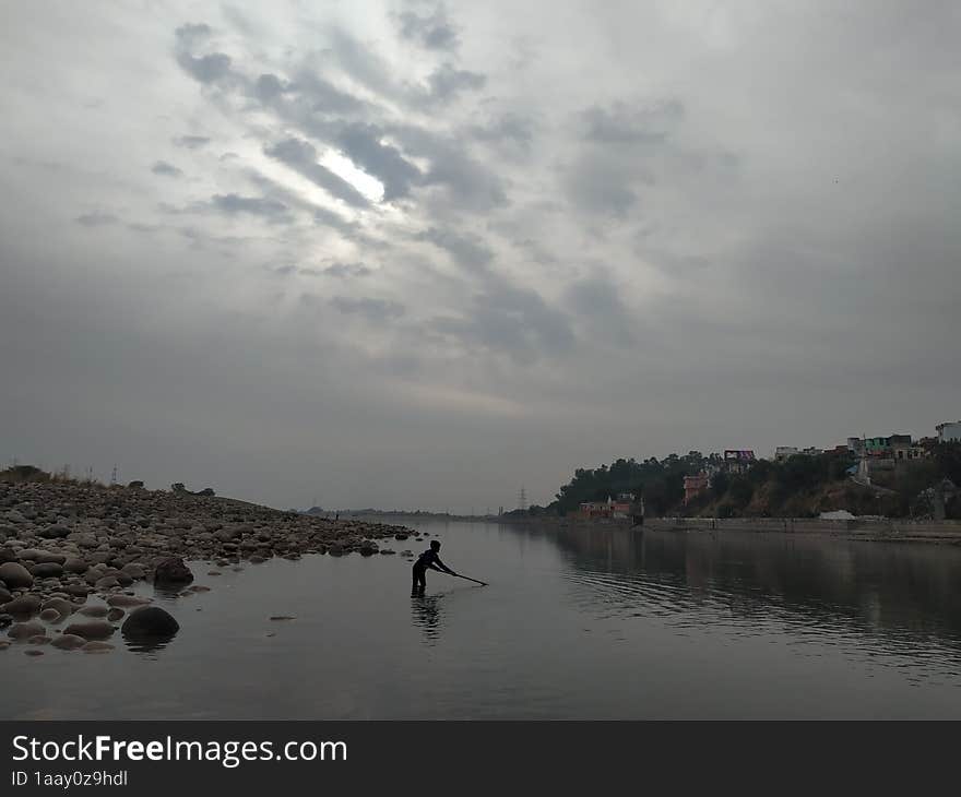 fishing in shallow water in Akhnoor, Jammu