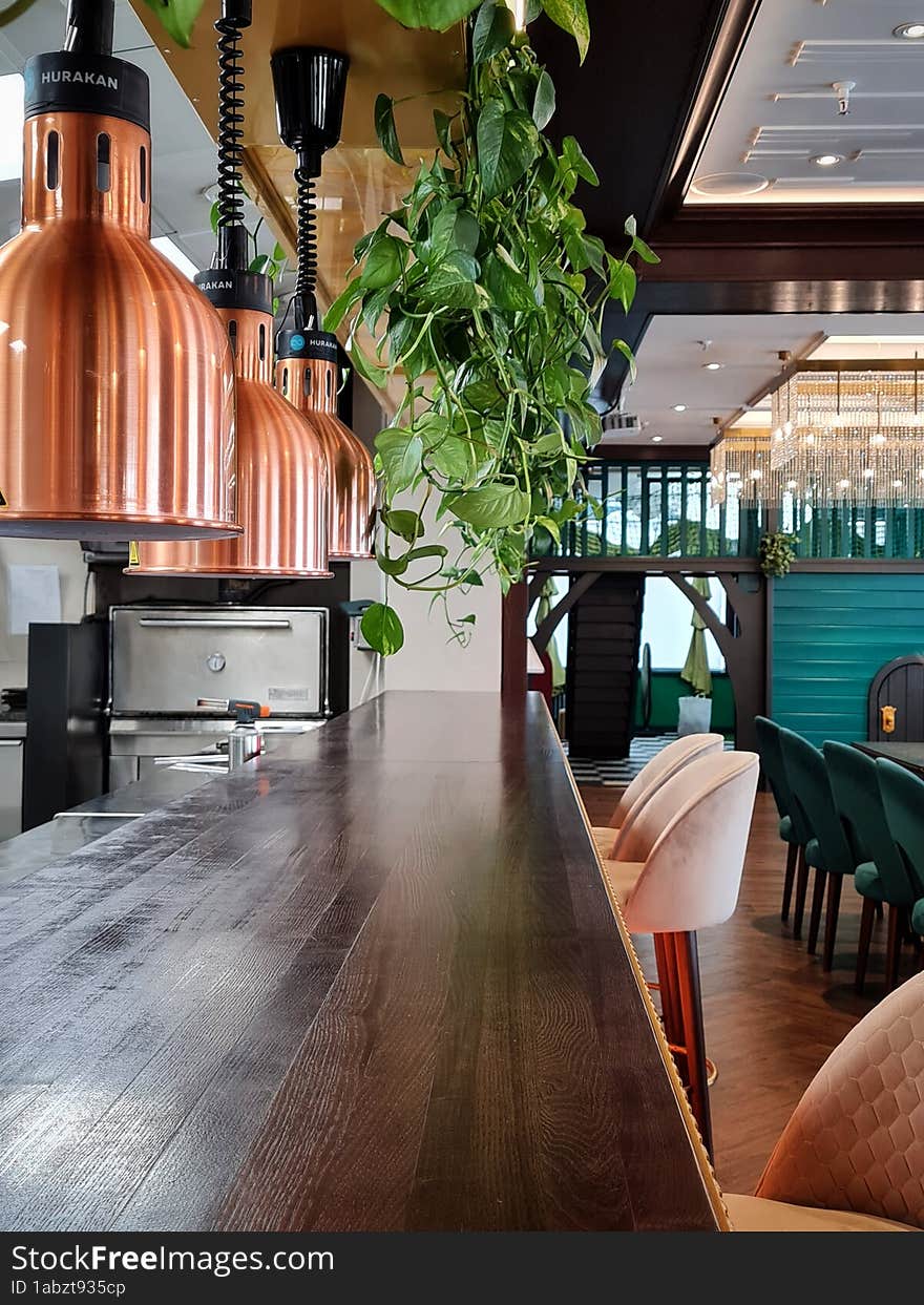 Bronze lamps for heating food over the serving table in a restaurant