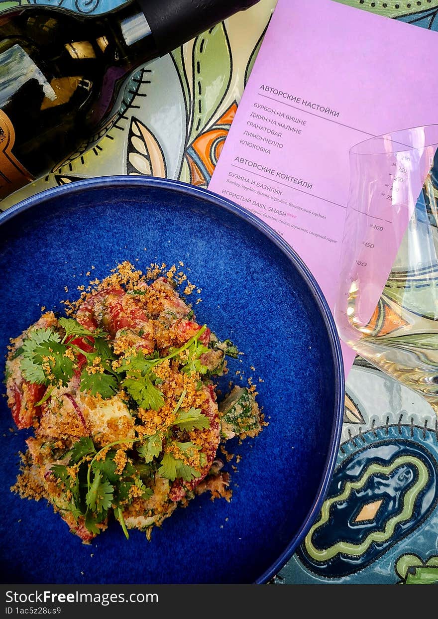 Top view of georgian salad, wine and rose menu