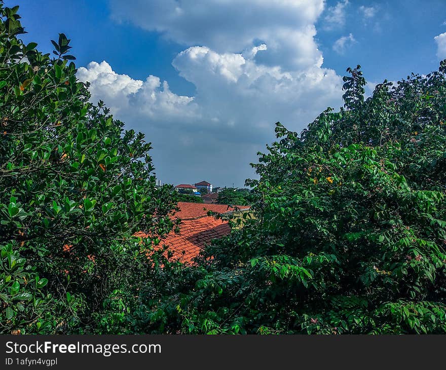 building city and green natural scenery with beautiful and cool clouds that are pleasing to the eye