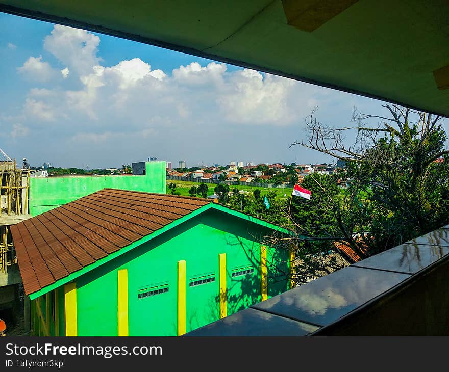 building city and green natural scenery with beautiful and cool clouds that are pleasing to the eye