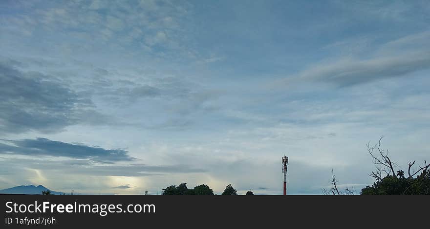 building city and green natural scenery with beautiful and cool clouds that are pleasing to the eye