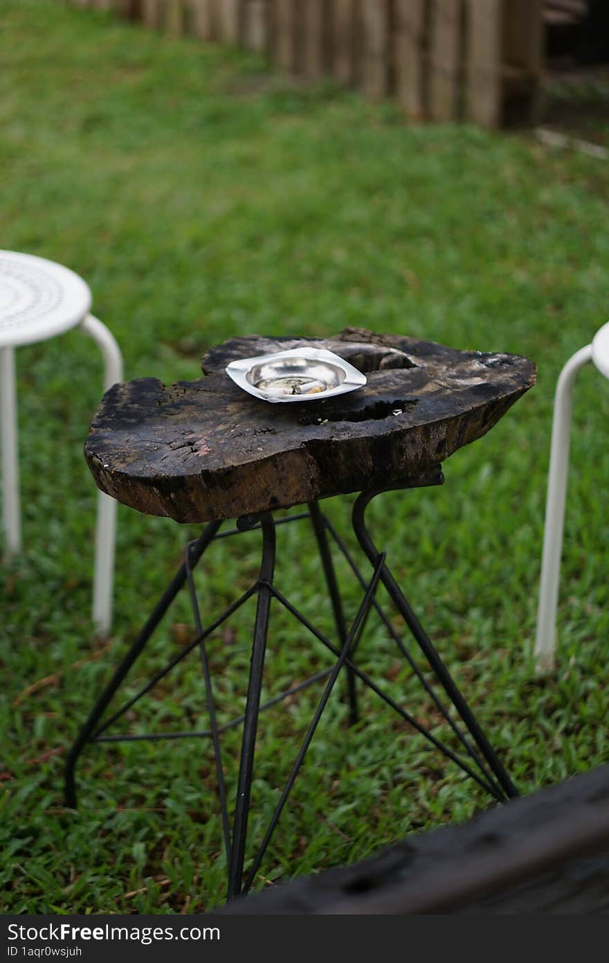 ashtray on a  wooden table